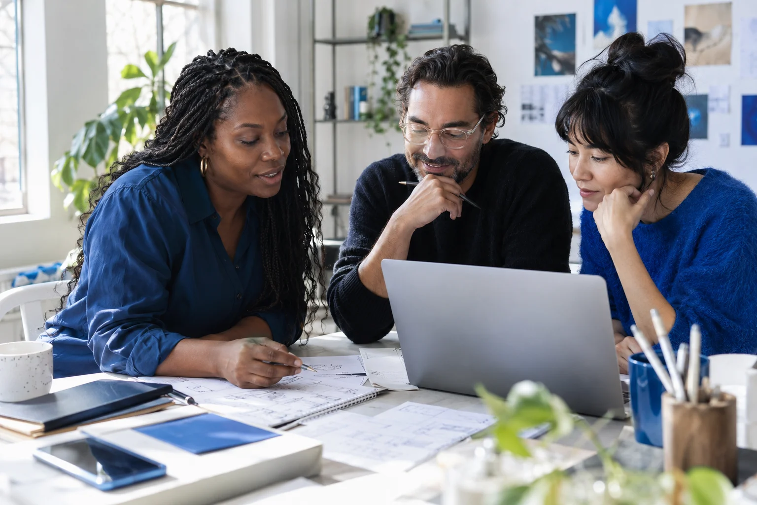 Business professionals reviewing a plan together in a bright studio
